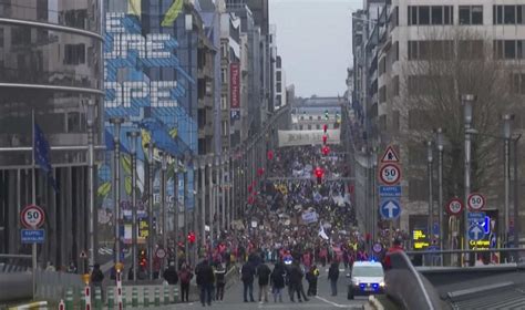Thousands of climate change activists hold boisterous protest march in Brussels with serious message